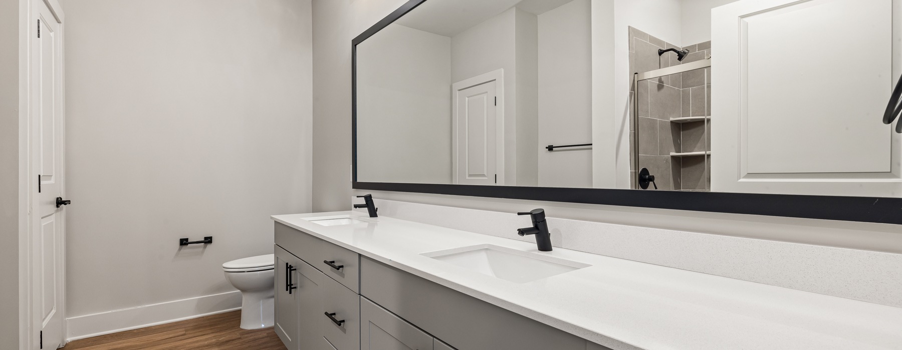 Spacious bathroom with large vanity and ample lighting