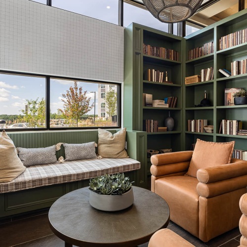 Clubhouse bookshelves filled with books in reading corner